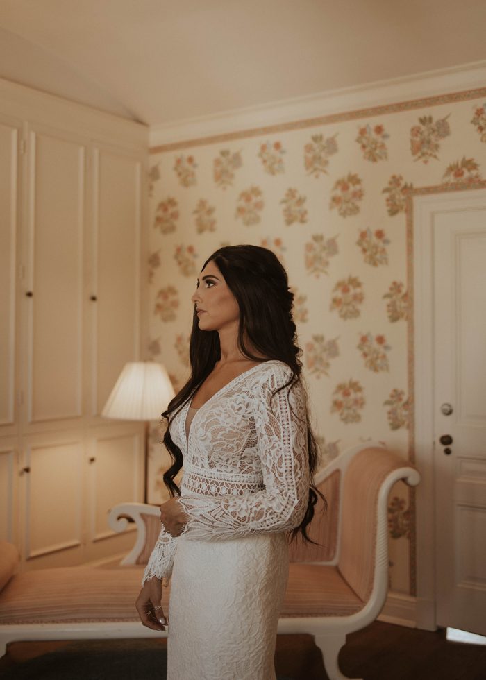 Bride wearing Drita wedding dress by Maggie Sottero in a Pantone Color of the Year 2024 dressing room