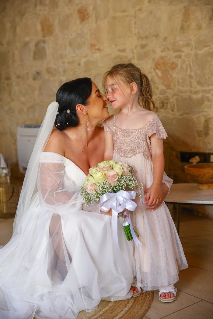 Alice wearing Nerida by Sottero and Midgley with her flower girl