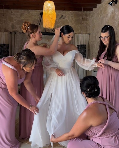 Alice wearing Nerida by Sottero and Midgley surrounded by bridesmaids