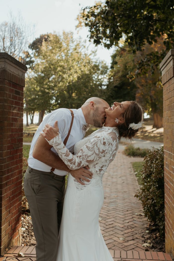 Bride wearing crepe fabric wedding dress Dionne by Rebecca Ingram