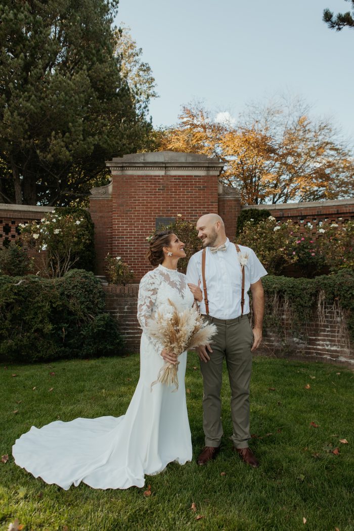 Bride wearing crepe fabric wedding dress Dionne by Rebecca Ingram