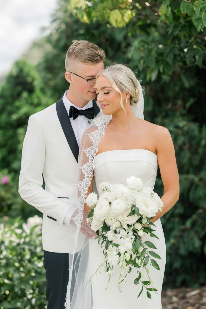 Bride wearing crepe fabric wedding dress Francine by Rebecca Ingram