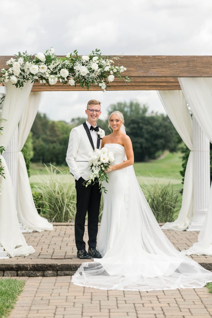 Bride wearing crepe fabric wedding dress Francine by Rebecca Ingram