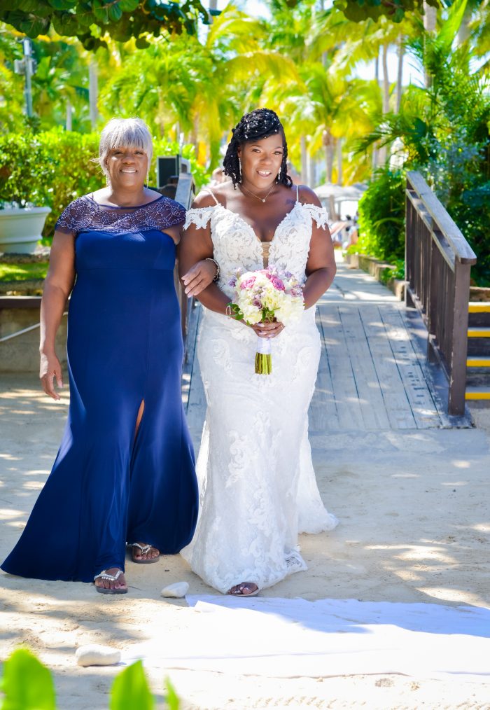 Bride wearing Tuscany Royale by Maggie Sottero walking with the mother of the bride