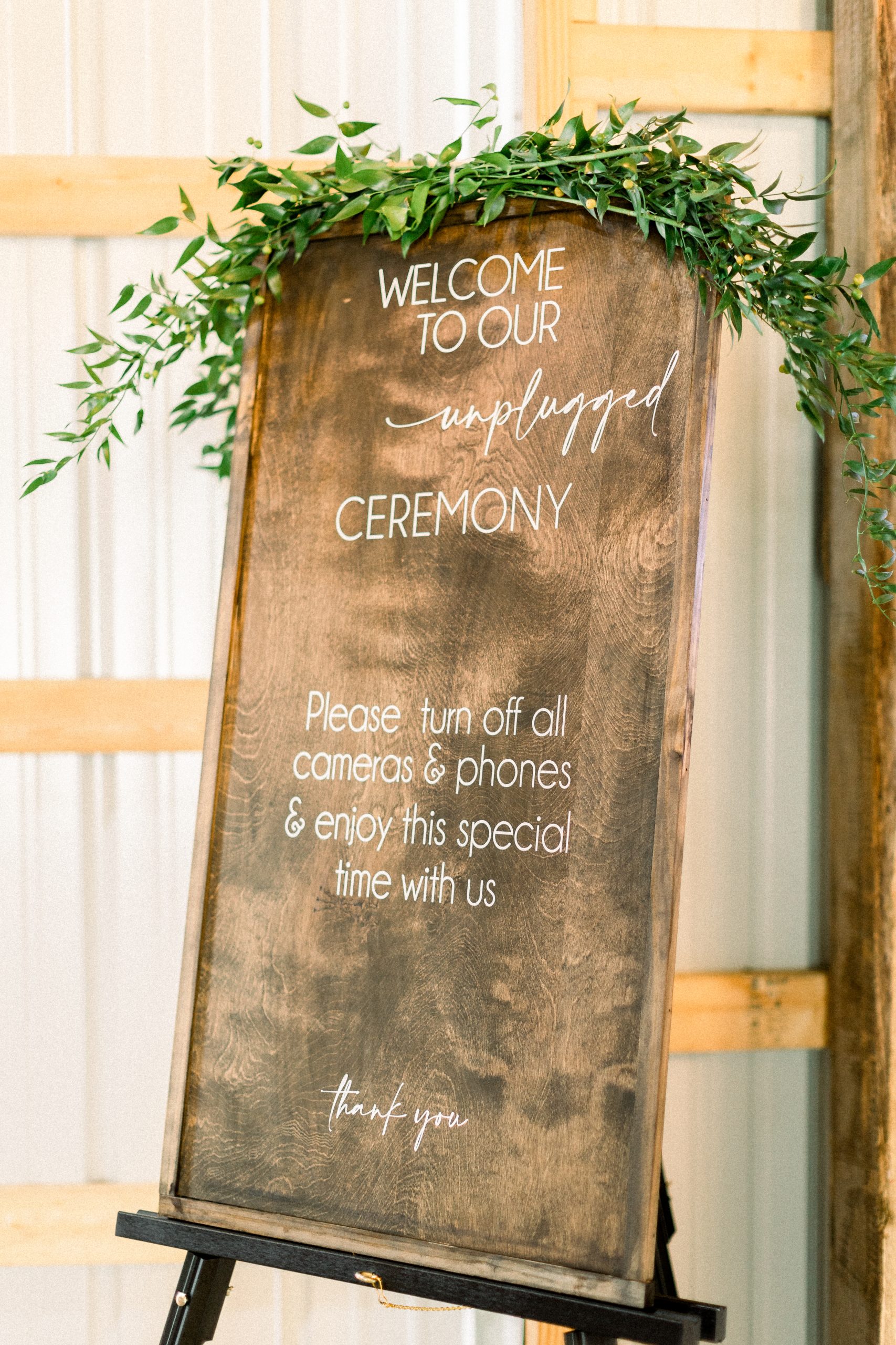 Unplugged ceremony sign at a garden party wedding