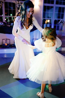 Riley wearing Fernanda by Maggie Sottero with her flower girl