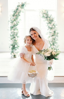 Riley wearing Fernanda by Maggie Sottero with her flower girl