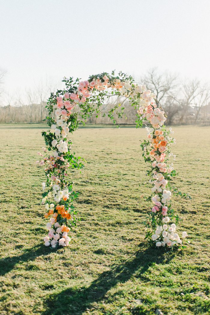 Floral arch in spring wedding colors