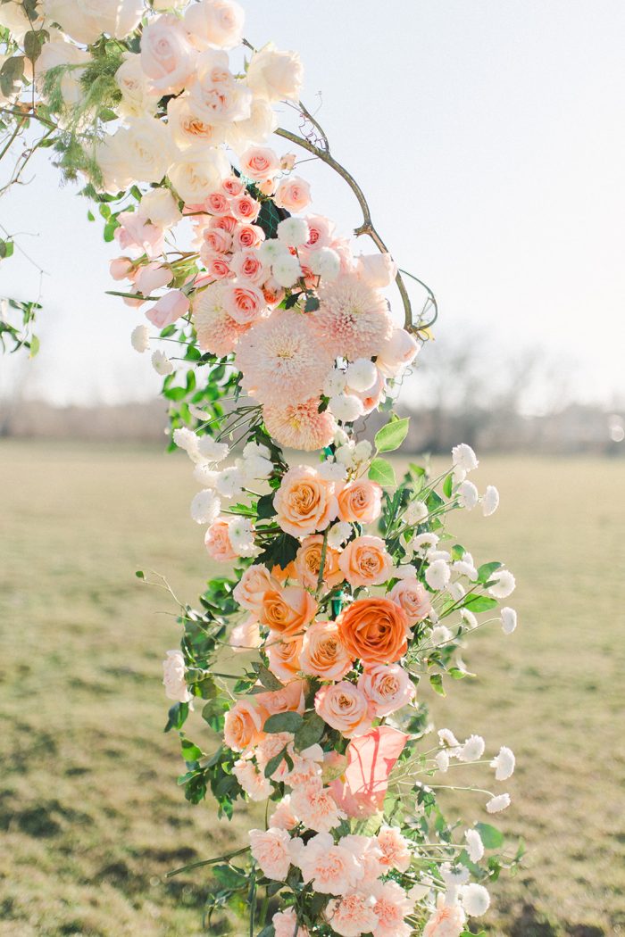 Floral arch in spring wedding colors