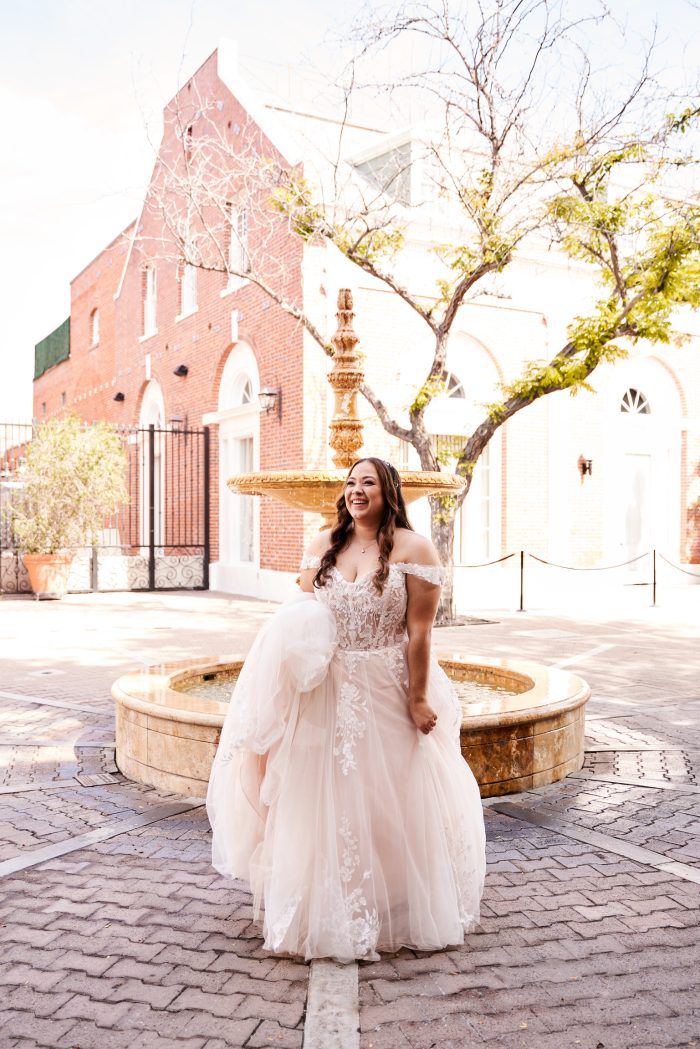 Bride wearing plus size wedding dress Harlem by Maggie Sottero