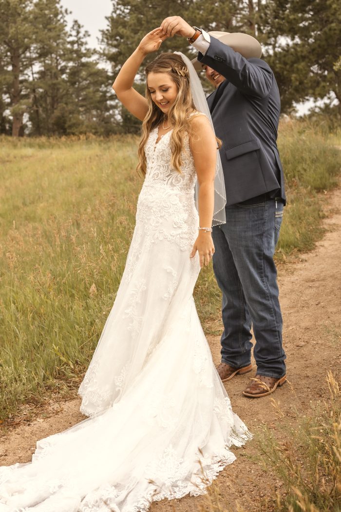 Bride wearing western wedding dress Johanna by Maggie Sottero with her husband