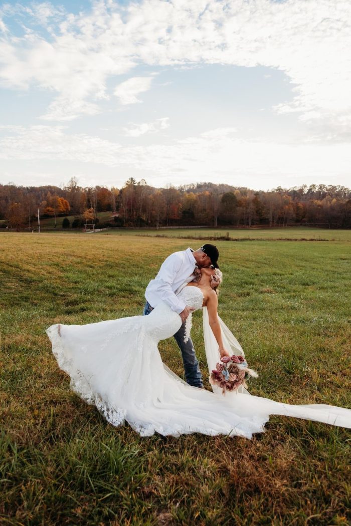 Bride wearing western wedding dress Lennon by Maggie Sottero with her husband
