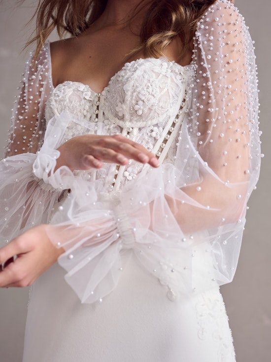 Bride wearing Doritte Sleeves bridal accessory