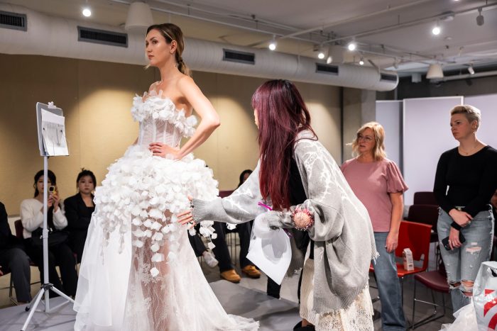 Model wearing a wedding dress designed by Otis students during upcycling mentorship project