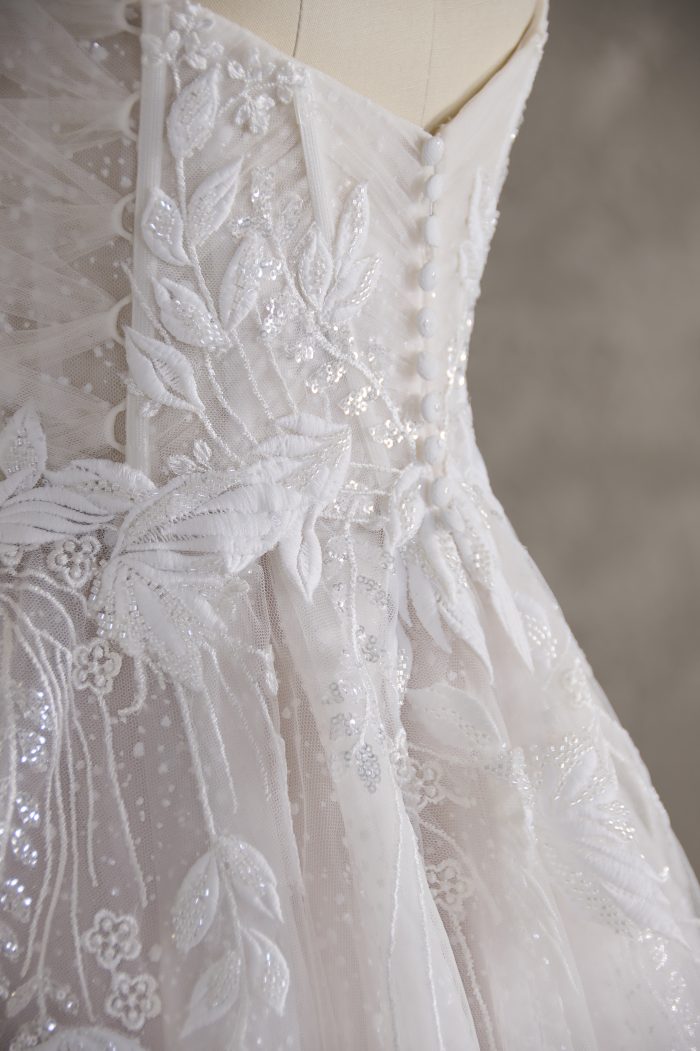 Button wedding dress customizations on Quinndalyn by Sottero and Midgley