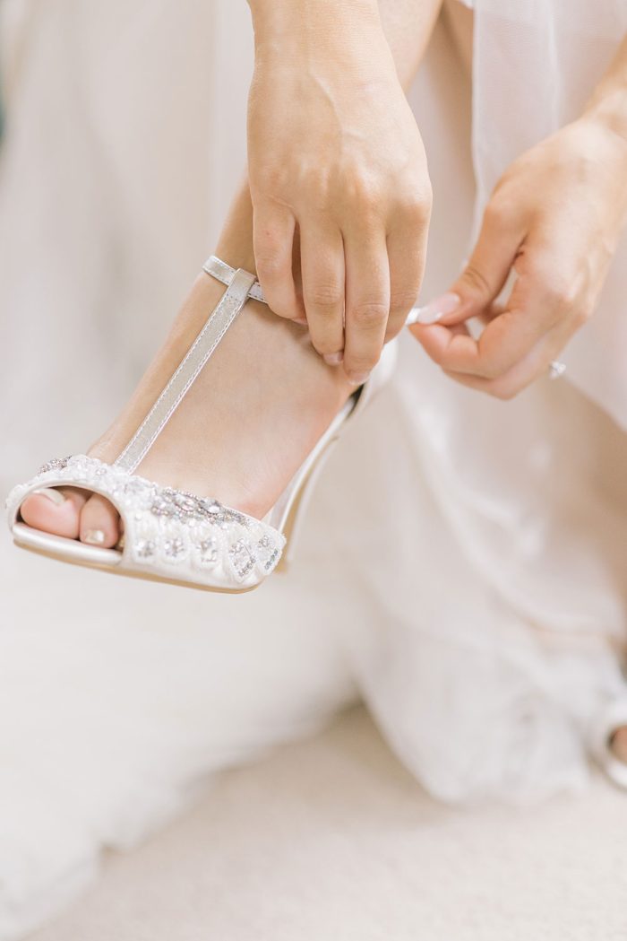 A bride checking her wedding heels as part of her wedding checklist