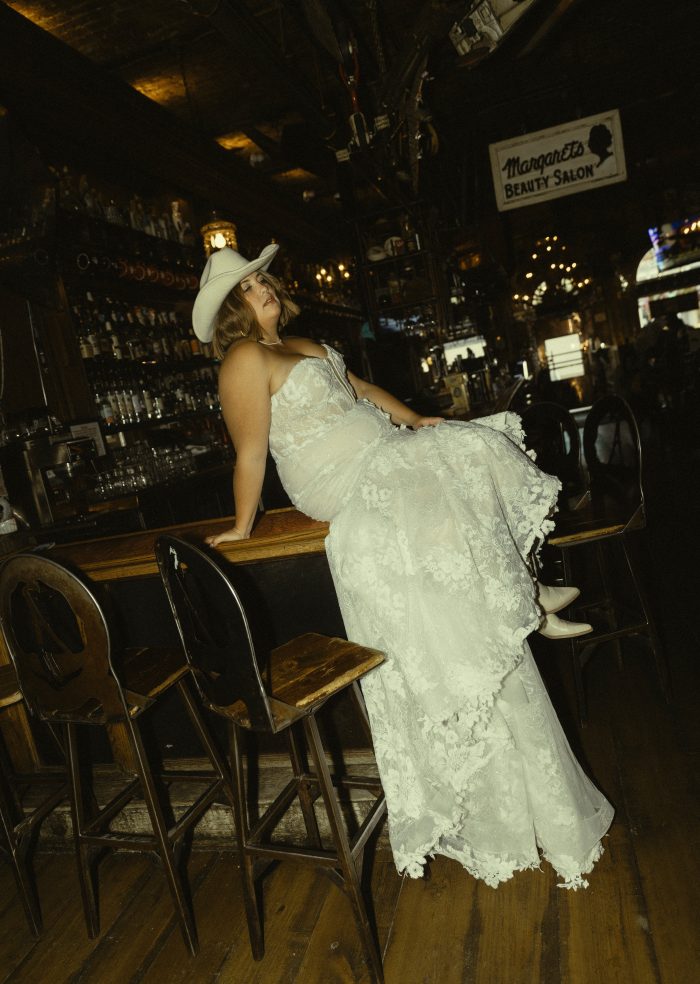 Bride wearing a bridal gown by Maggie Sottero in a Western styled shoot