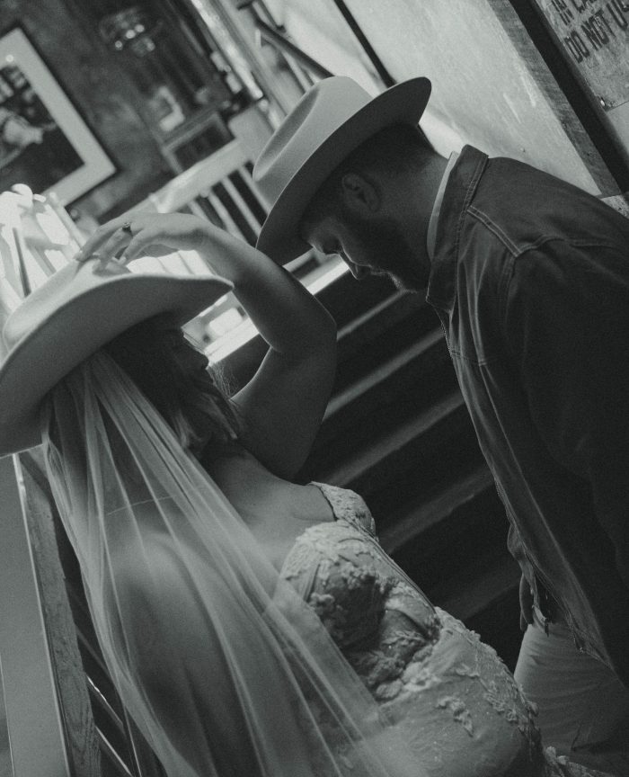 Bride wearing a bridal gown by Maggie Sottero in a Western styled shoot