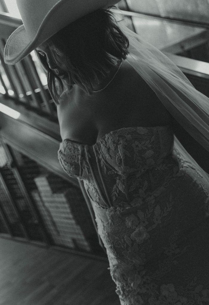 Bride wearing a bridal gown by Maggie Sottero in a Western styled shoot