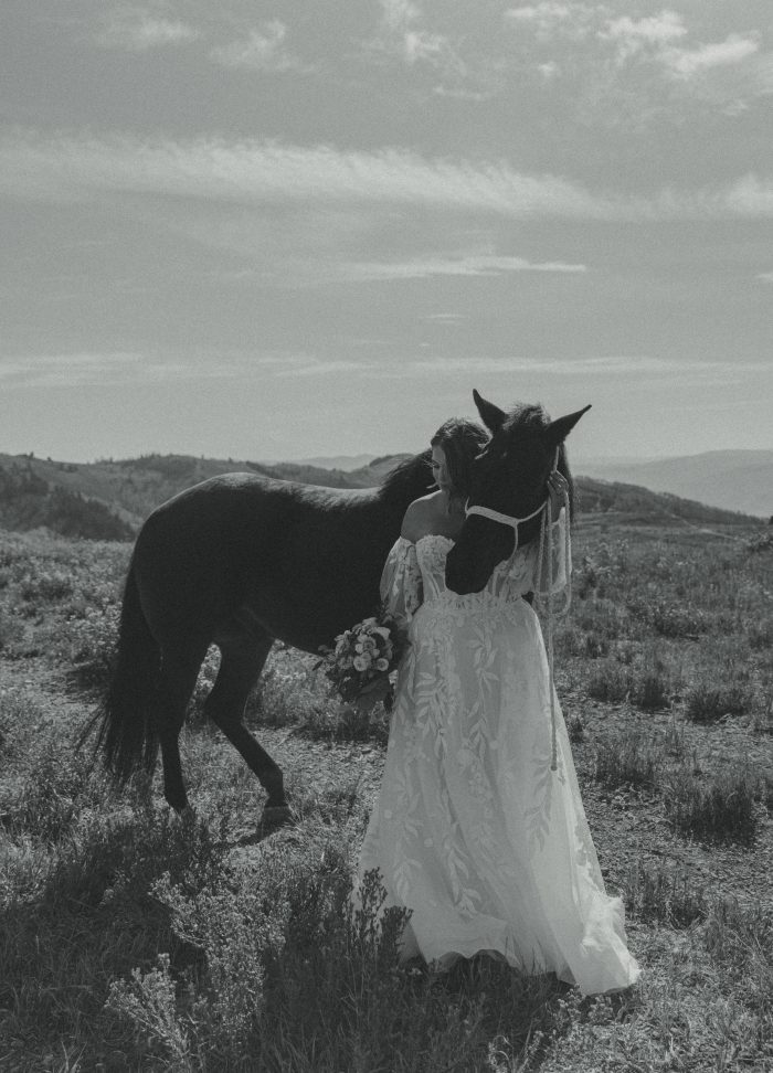 Bride wearing a bridal gown by Maggie Sottero in a Western styled shoot