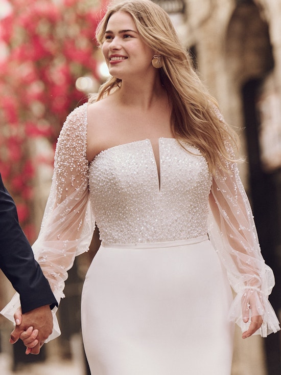 Bride wearing one of our long sleeve wedding dresses called Heyda by Rebecca Ingram