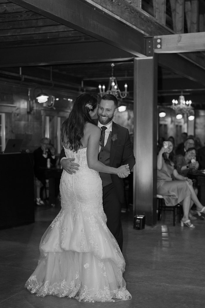 Bride wearing Lennon by Maggie Sottero dancing with her husband