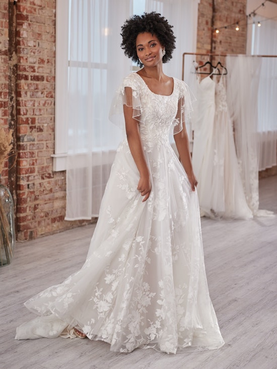 Bride wearing Winter Leigh modest wedding gown by Maggie Sottero