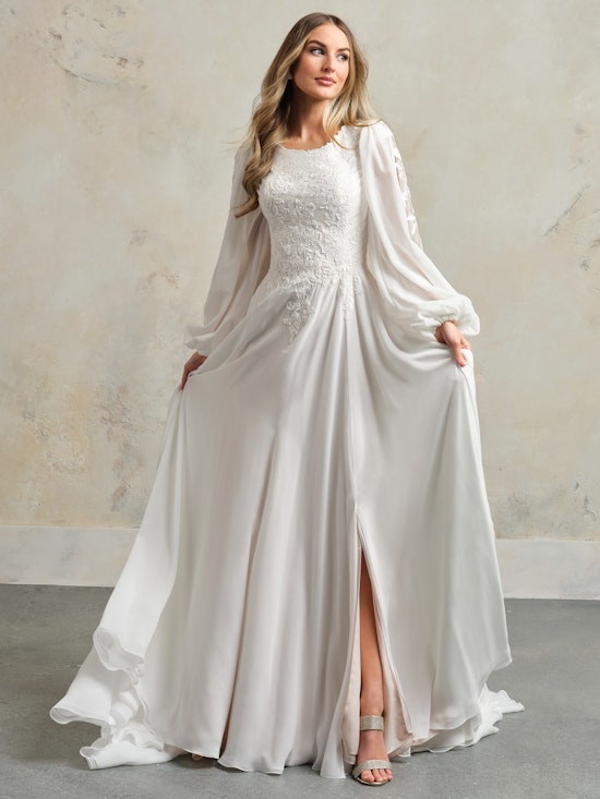 Bride wearing Dagney Leigh modest wedding gown by Rebecca Ingram