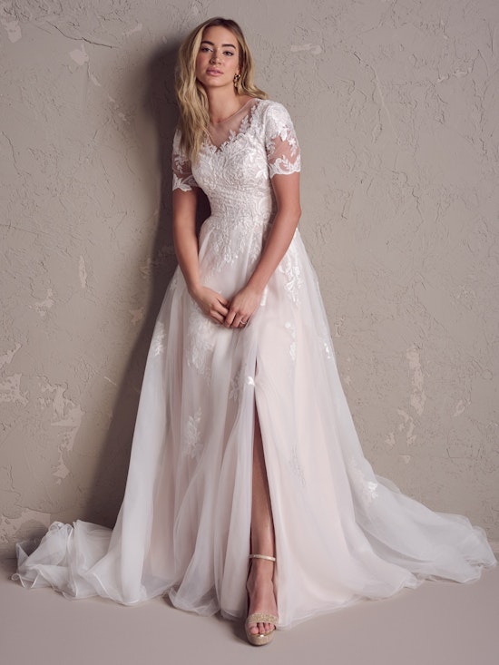 Bride wearing Dolly Leigh modest wedding gown by Rebecca Ingram