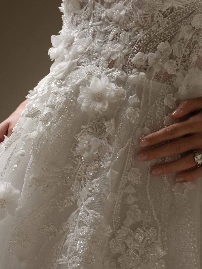 Bride wearing Logan by Sottero and Midgley, featuring floral and lace wedding dress trends