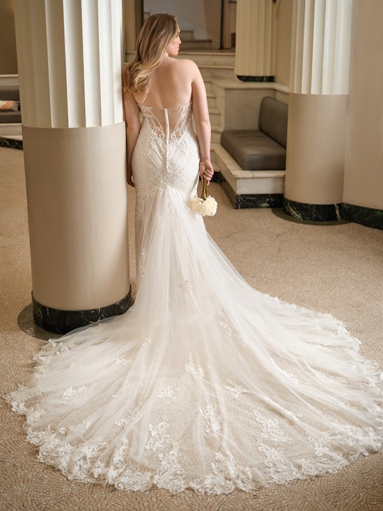 Bride wearing Rome off-the-shoulder wedding dress by Sottero and Midgley