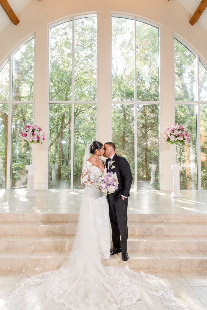 Bride wearing Tuscany Royale by Maggie Sottero kissing her husband