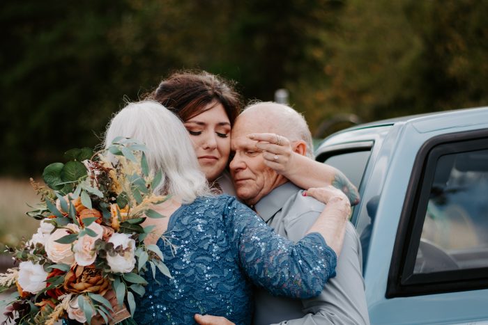 Girl hugging her parents