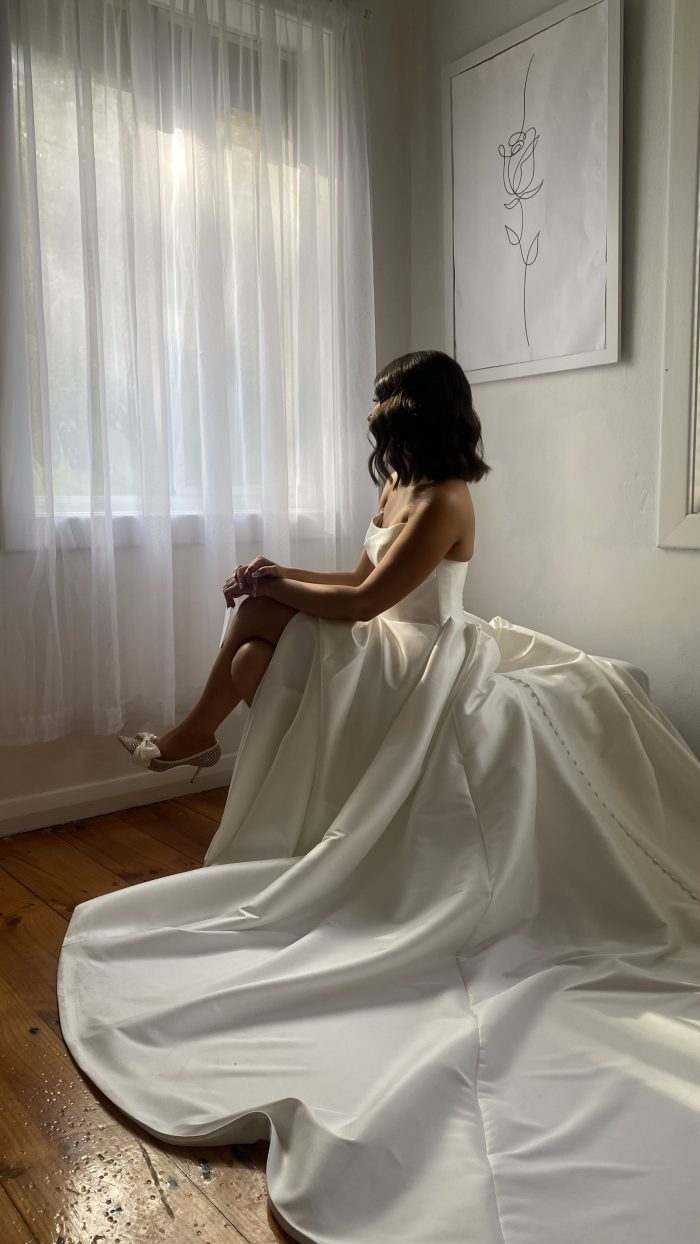 Bride wearing Aspen satin wedding dress by Sottero and Midgley