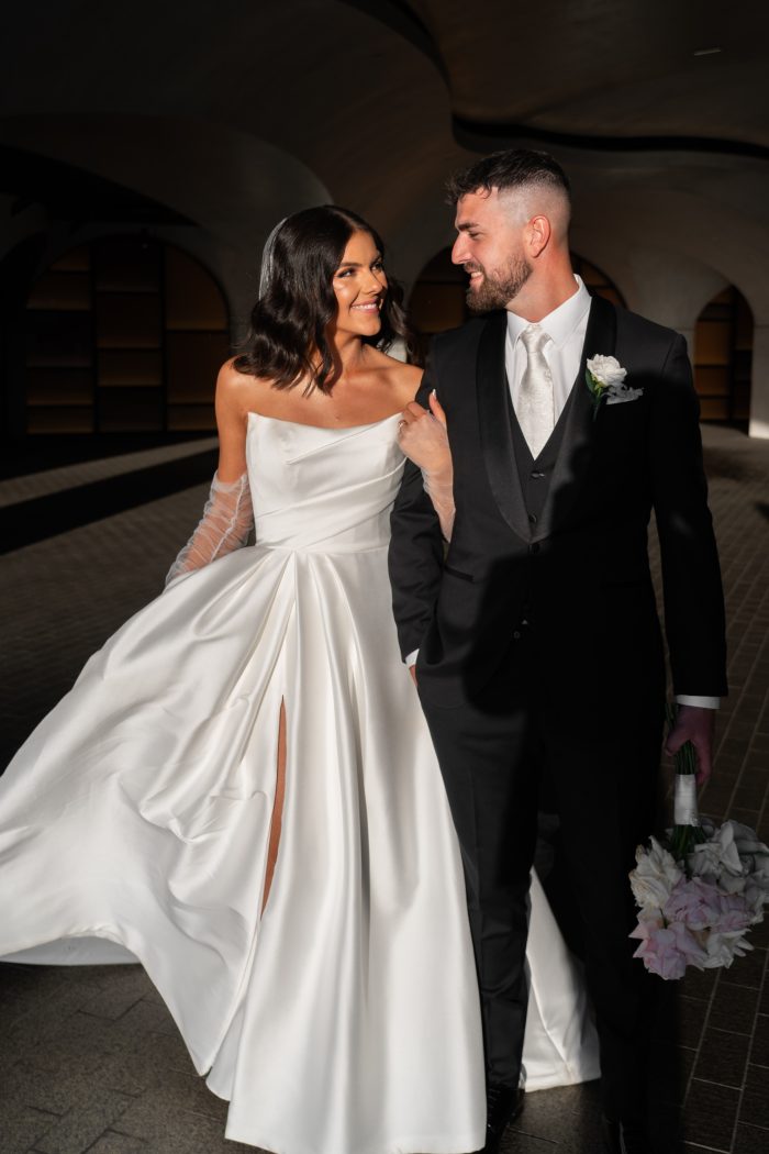 Bride wearing Aspen satin wedding dress by Sottero and Midgley