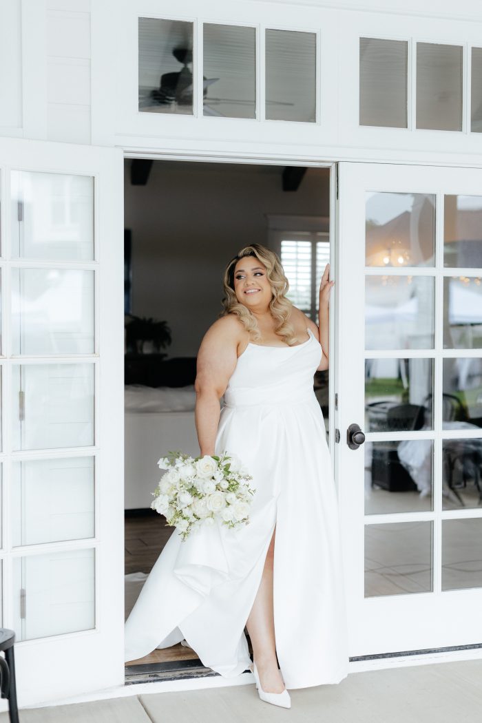 Bride wearing Aspen satin wedding dress by Sottero and Midgley