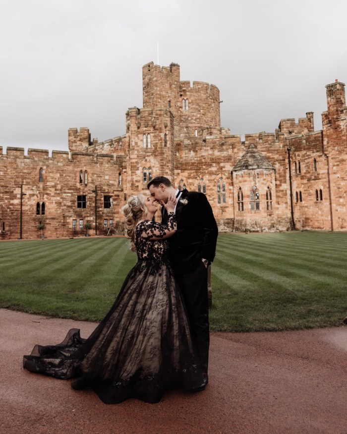 Bride wearing Zander black wedding dress by Sottero and Midgley with her husband