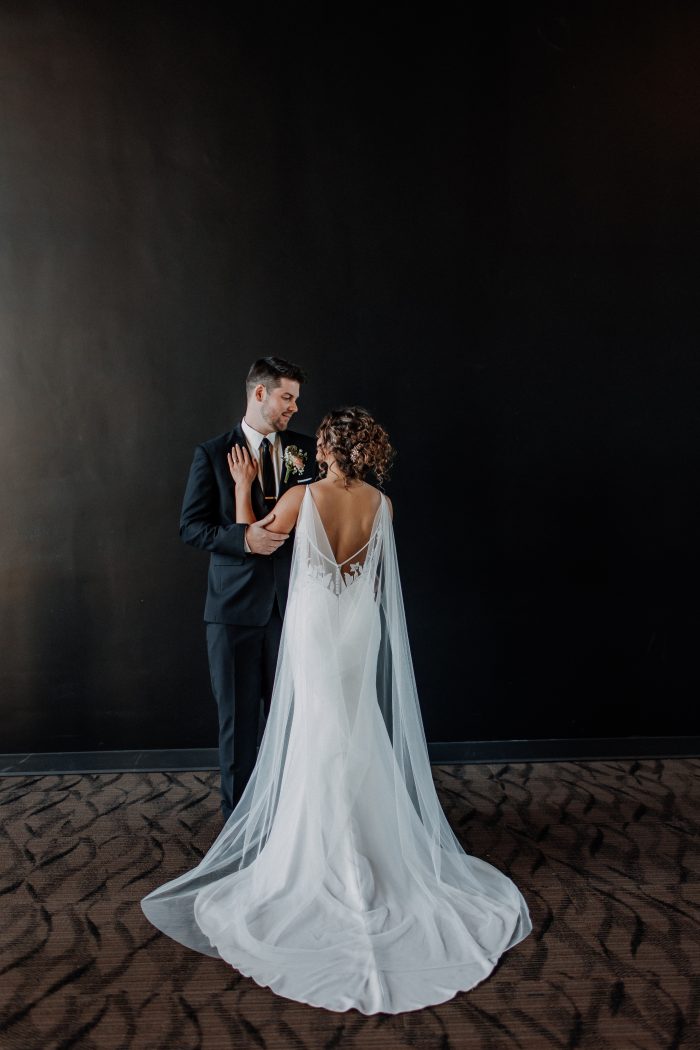 Bride wearing Dionne backless wedding dress by Rebecca Ingram