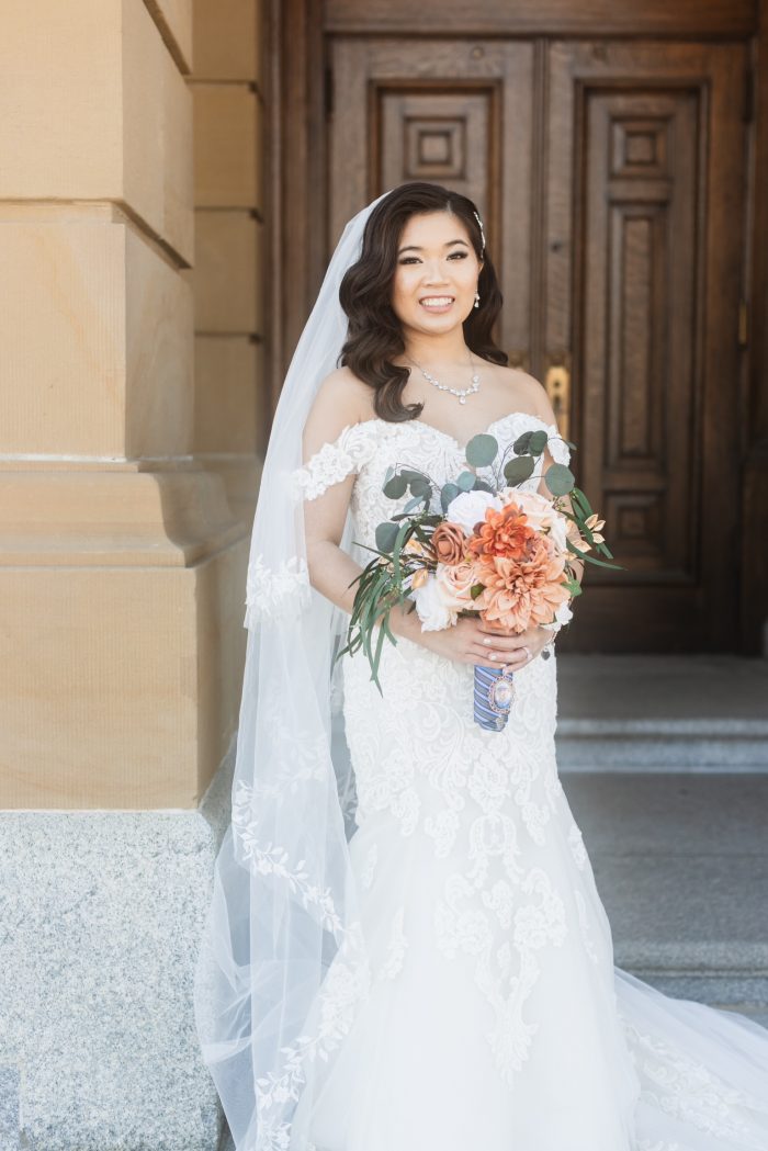 Bride wearing Fiona mermaid wedding dress by Maggie Sottero