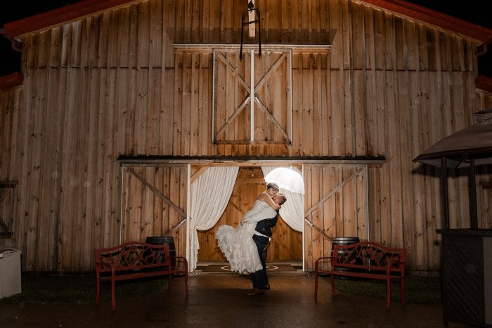 Bride wearing western wedding dress Fiona by Maggie Sottero with her husabnd