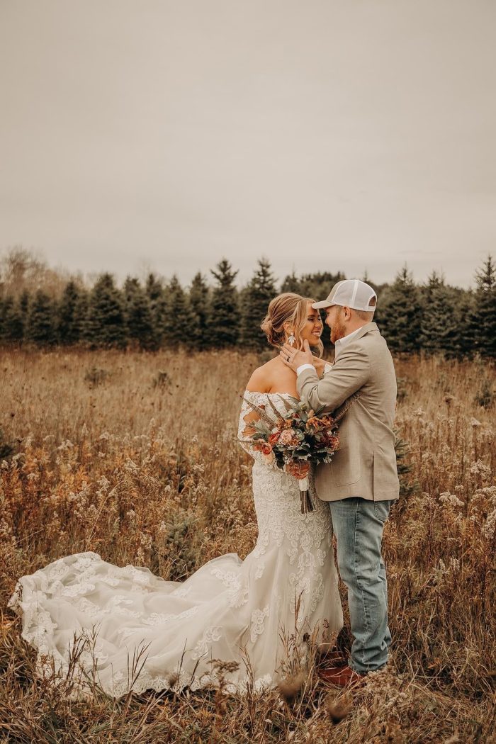 Bride wearing Fiona western wedding dress by Maggie Sottero with her husband