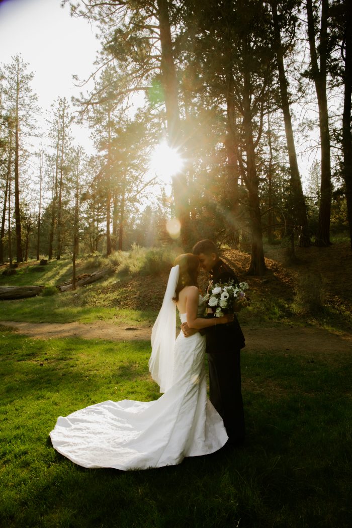 Bride wearing Hilo mermaid wedding dress by Maggie Sottero