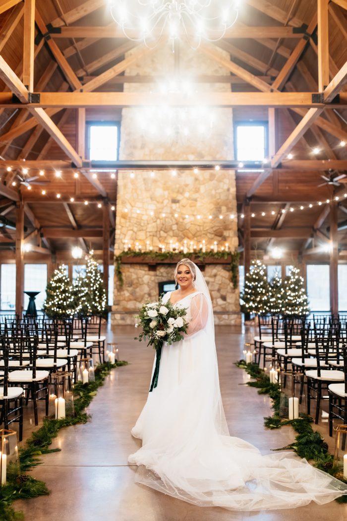 Bride wearing Joanne winter wedding dress by Rebecca Ingram