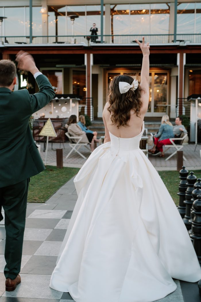 Bride wearing Selena satin wedding dress by Maggie Sottero