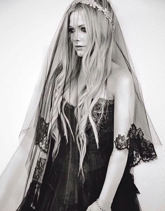 Avril Lavigne wearing her black wedding dress