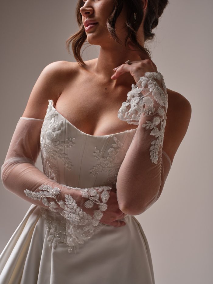 Bride wearing a square neckline wedding dress with embellishments