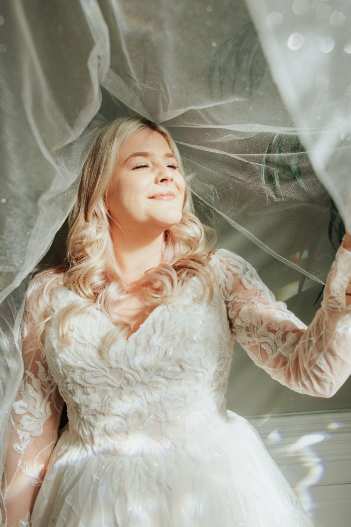 Brittany wearing one of Maggie Sottero's maternity wedding dresses