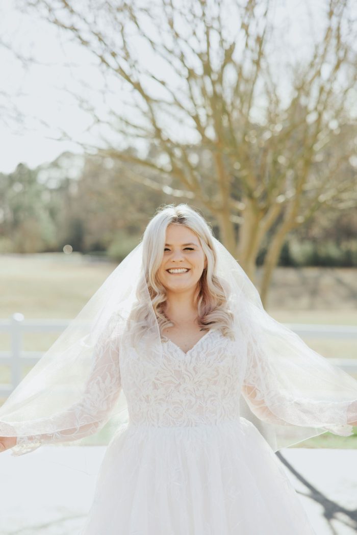 Brittany wearing one of Maggie Sottero's maternity wedding dresses