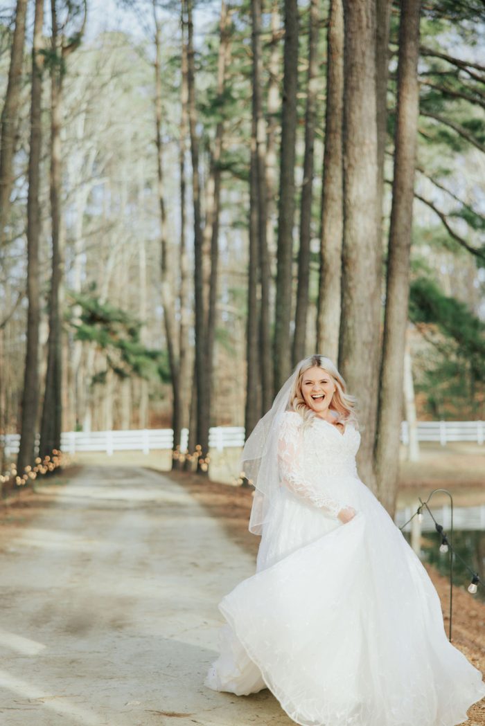 Brittany wearing one of Maggie Sottero's maternity wedding dresses