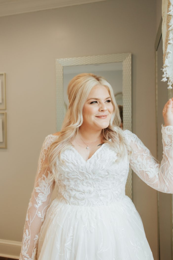 Brittany wearing one of Maggie Sottero's maternity wedding dresses